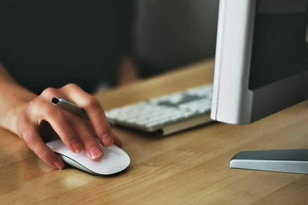 Image of someone's hand on a mouse