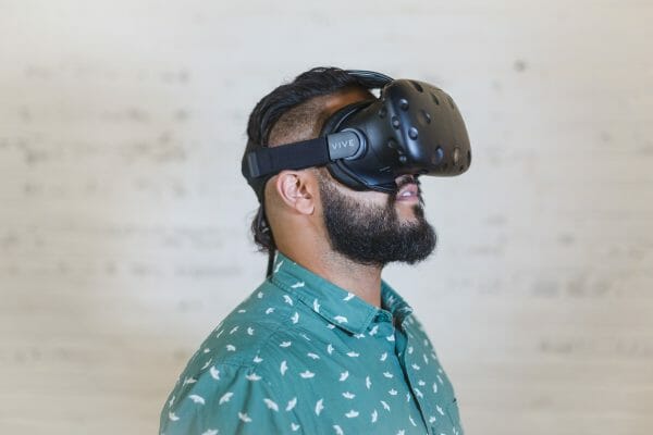 Man wearing an HTC VIve, VR headset