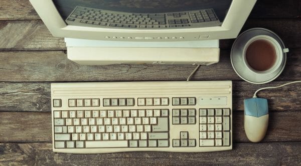 Top down view of an old computer and keyboard