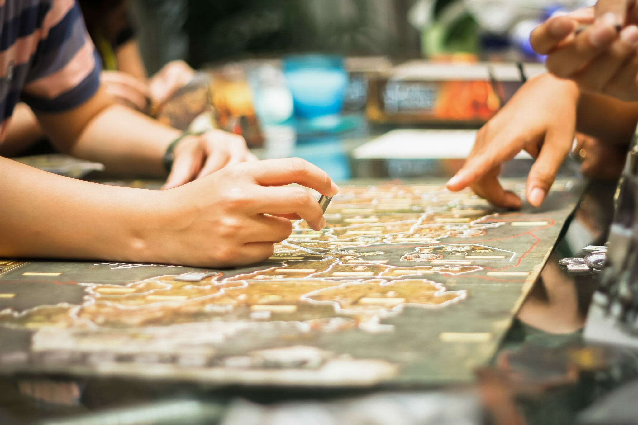 Hands planning out something on a board